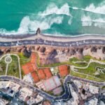 bird's eye photography of village beside water